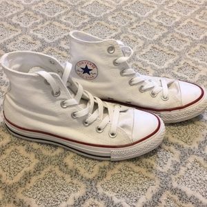 White Converse high tops.